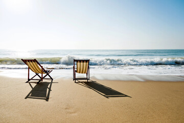 Fototapeta na wymiar Two chairs on the beach.