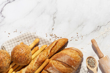 Background with different types of fresh bread. Bakery products. Cooking.