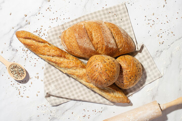 Background with different types of fresh bread. Bakery products. Cooking.