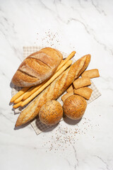 Background with different types of fresh bread. Bakery products. Cooking.
