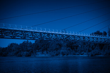 Fototapeta premium Night landscape at Sacramento River with the view of Sundial Bridge in Redding, Northern California