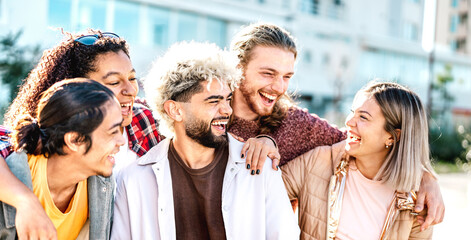 Lifestyle concept with multicultural friends laughing together - Happy young millenial people...