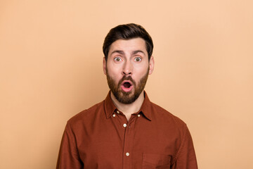 Portrait of impressed shocked young person open mouth cant believe isolated on beige color background