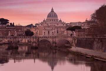 Fototapeta na wymiar Lovely view of St Peter's Basilica (San Pietro) in Vatican City, Italy, Europe, at sunset. It is a famous landmark of Vatican. Nice cityscape of the old Roma in winter 
