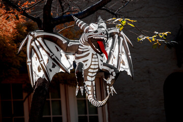 Skeleton Demon Dragon blowup Halloween yard art - hanging from tree - long red tongue - evil