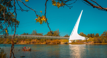 Autumn foliage and landscape at Sacramento River with the view of Sundial Bridge in Redding,...