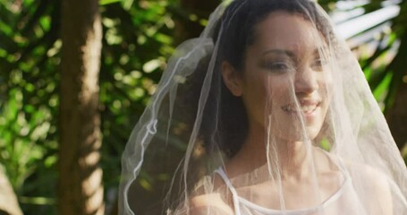 Portrait of happy african american woman wearing wedding dress