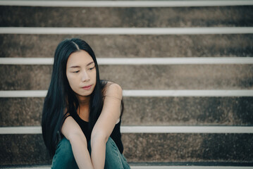 Beautiful thai woman very sad from unrequited love,rethink,think over,vintage style,dark tone,broken heart,asian girl