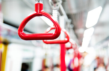 Red handles in the subway