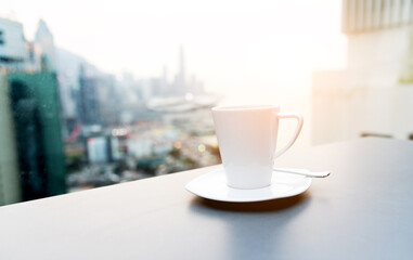 Coffee cup with blur city background