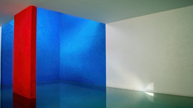 interior of the gilardi house of the famous architect luis barragan, pool reflecting the light, blue wall and red column, mexico