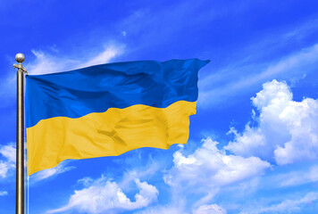 Ukraine Flag Waving In The Wind On A Beautiful Summer Blue Sky