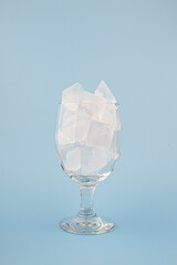 ice in glass isolated on skyblue background