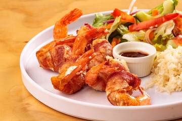 Fried shrimp with bacon, sweet sauce, salad and rice, food, gastronomy