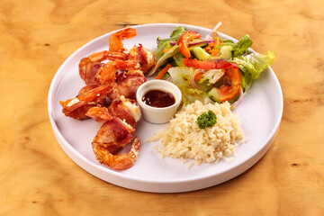 Fried shrimp with bacon, sweet sauce, salad and rice, food, gastronomy