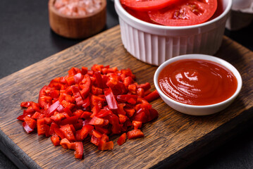 Ingredients for making shakshuka, dishes with fried eggs with tomato sauce, spices and herbs