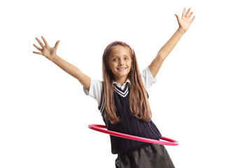 Smiling happy girl playing with a hula hoop