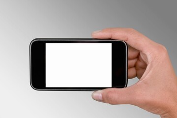 Hand holding smartphone with blank screen for Infographic Global Business web site design app