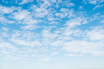 Naklejka na ściany i meble The blue sky covered with white clouds