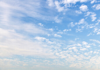 The blue sky covered with white clouds