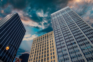 Fototapeta na wymiar skyscrapers and office buildings in the city skyline with powerful clouds at sunset in downtown Atlanta Georgia USA
