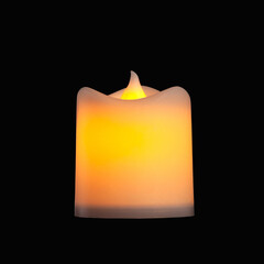 Electric candle. Candle shaped light fixture isolated on a black