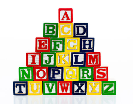 Wooden alphabet blocks on white background