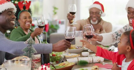 Happy african american family having christmas dinner