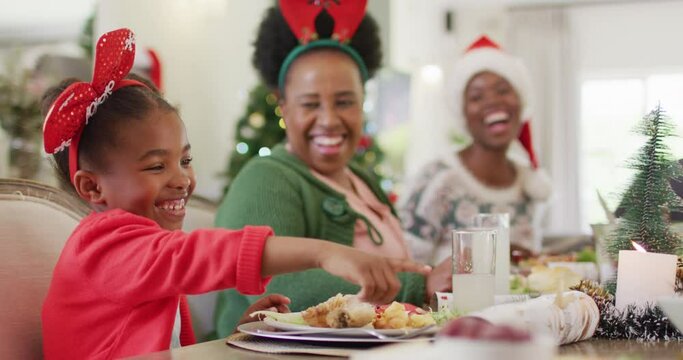 Happy african american family having christmas dinner