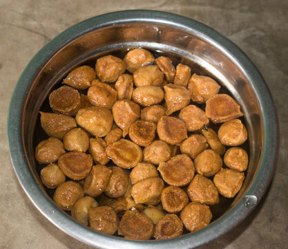 roasted and soaked yellow moong vadi or urad warian in water.