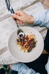 semolina porridge with pear hand girl