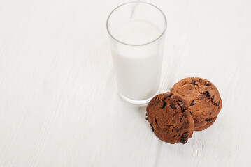 A glass of milk and chocolate biscuits for breakfast