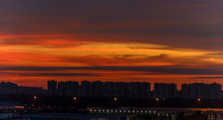Bright summer sunset in the city taken from a tall building.