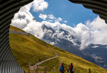 People hiking to Eiger Glacier in Kleine Scheidegg, Switzerland.