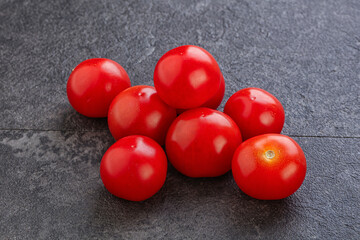 Ripe juicy cherry tomatoes heap