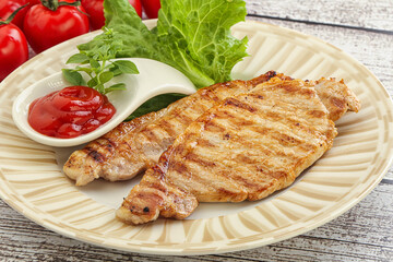 Grilled pork steak with ketchup