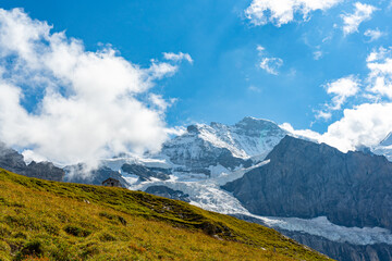 Panorama view of Eiger, Mönch and Jungfrau in summer. Summer holidays in Europe.