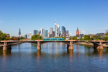 Fototapeta na wymiar Frankfurt skyline with Main river and tram on Ignatz Bubis Bridge travel traveling in Germany