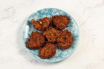 Indian spicy vegetable pakora or pakoda served in dish isolated on table top view