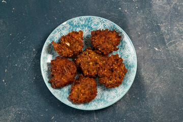 Indian spicy vegetable pakora or pakoda served in dish isolated on table top view