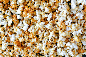 Fototapeta na wymiar Popcorn texture background. Delicious snack. Butter popcorn is a famous snack. Homemade meal. Popcorn concept. High quality photo