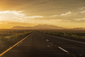 Sunset on an Asphalt with cloudy sky on the way to Flagstaff