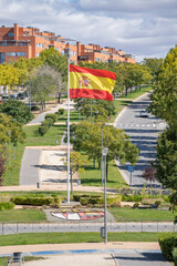 Big Spain waving flag on Paracuellos de Jarama , Madrid. Flag symbols of Spain