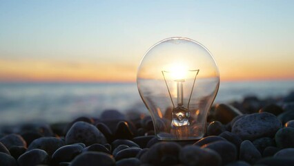 Light bulb at the sunset