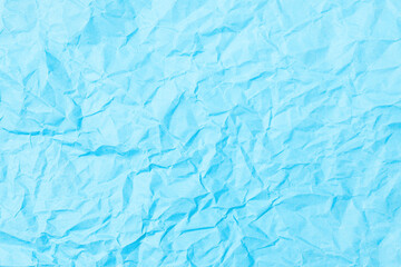 Blue crumpled paper background texture. Full frame
