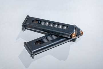 two clips with cartridges for a 9mm makarov pistol