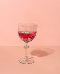 Red cocktail concept with pearls. New Year celebration idea. 