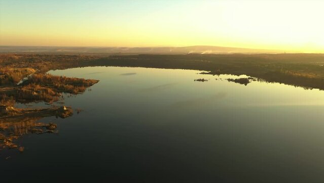 ukraine. kalush. flooded quarry. gold autumn