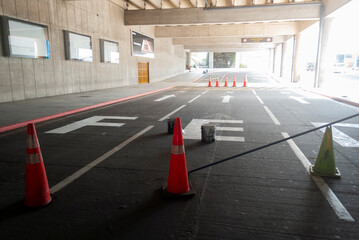 Road blockage in airport parking lot, space under asphalt repair.