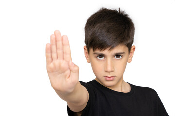 Little caucasian kid standing with outstretched hand showing stop sign, preventing you. Isolated on...